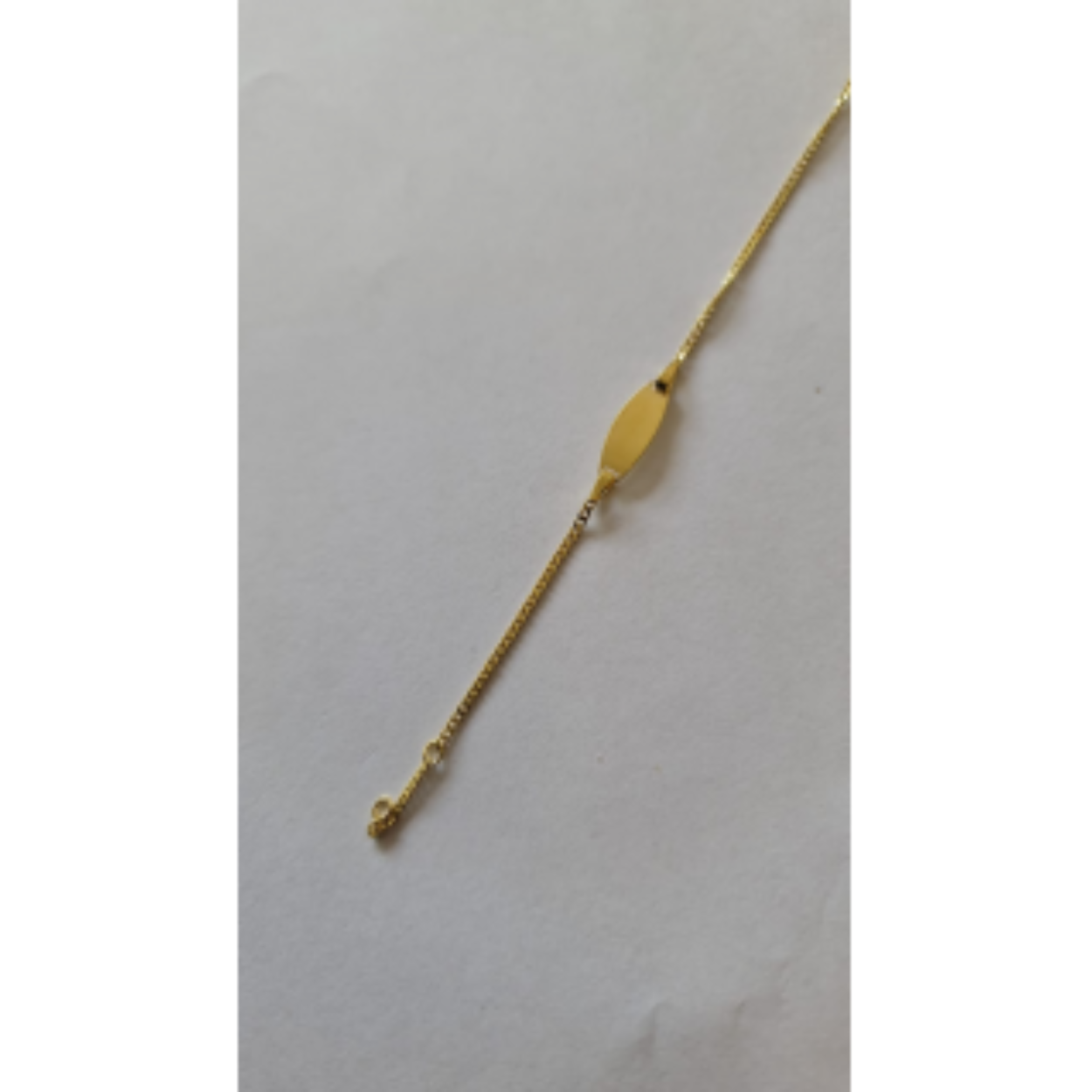14 karaats gouden graveerarmband met zilveren kern.
11-13cm
