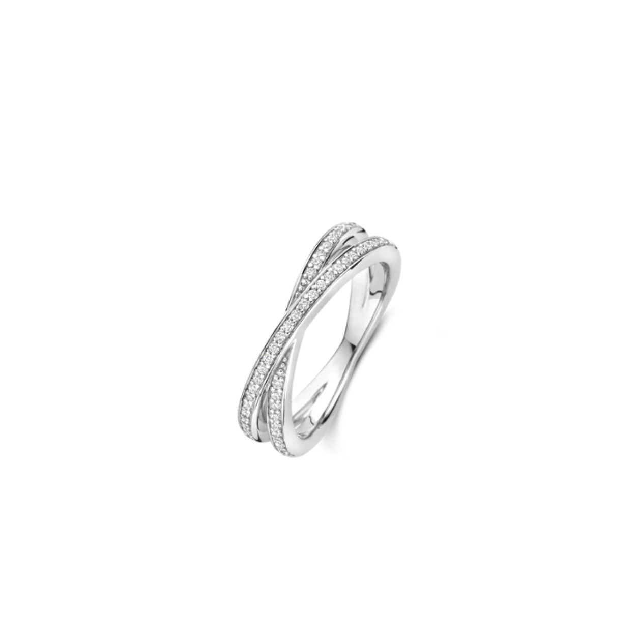 Deze TI SENTO pavé zilverkleurige ring 12373ZI combineert minimalistische verfijning met eigentijdse allure. Vervaardigd uit hoogwaardig 925 zilver, heeft dit elegante stuk twee slanke banden die zich sierlijk in een crossover-ontwerp verstrengelen—een symbool van verbinding, eenheid en moderne elegantie. Beide banden zijn gezet met pavé zirkonia's, wat een schitterend lichtspel vanuit elke hoek creëert. De delicate glinstering van elke steen voegt een laag subtiele glamour toe, terwijl de vloeiende crossover-silhouet een gevoel van beweging en harmonie aan het ontwerp geeft. Nikkelvrij en hypoallergeen, het belooft comfort zonder in te boeten aan stijl. Een delicate twist op klassiek design, het is een stuk dat spreekt van elegantie, verbinding en blijvende verfijning—gemaakt om je hand met stille zelfverzekerdheid te sieren.