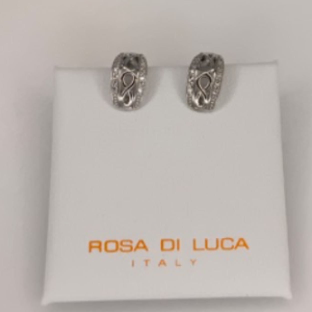 Zilveren oorringen rosa di luca open gewerkt met zirkonia