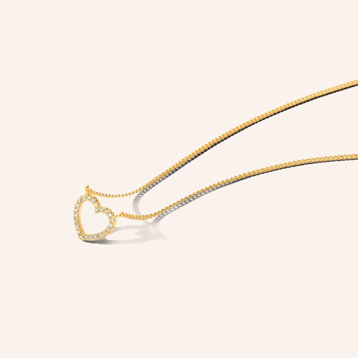 A tale as old as time, this classic Heart of Diamonds necklace will definitely make hearts skip a beat. For those crazy in love. Made in sterling silver, gilded with silver rhodium or 18 carat yellow or rose gold vermeil, handset with 18x natural and ethically-sourced diamonds.

Ref: M2256 | Necklace | 925 Sterling Silver | 10.00 x 9.20 mm | White Diamond: 24pc