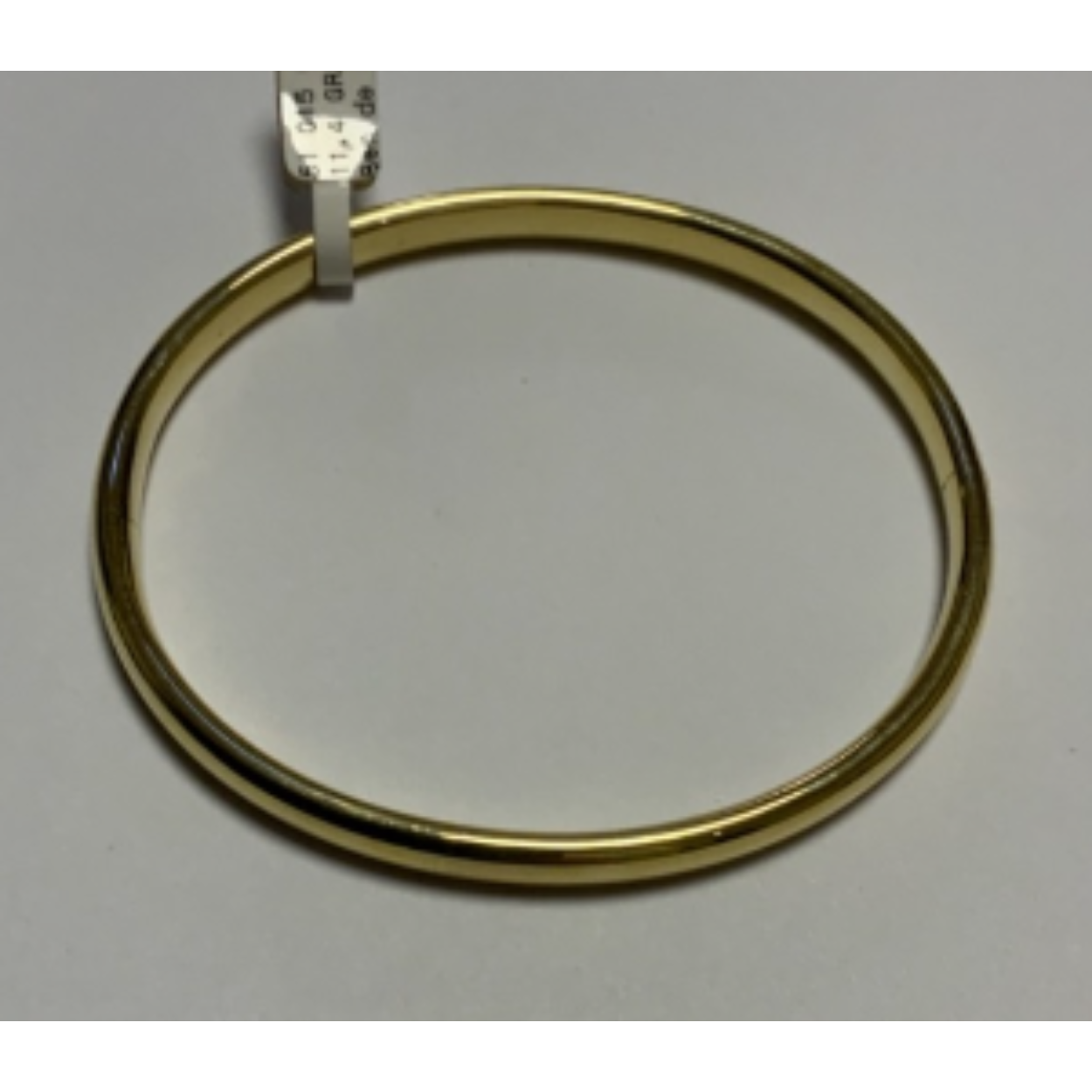 Goud bangle armband bol glad met scharnier.
Doorsnede; 63 mm
Breedte; 6 mm