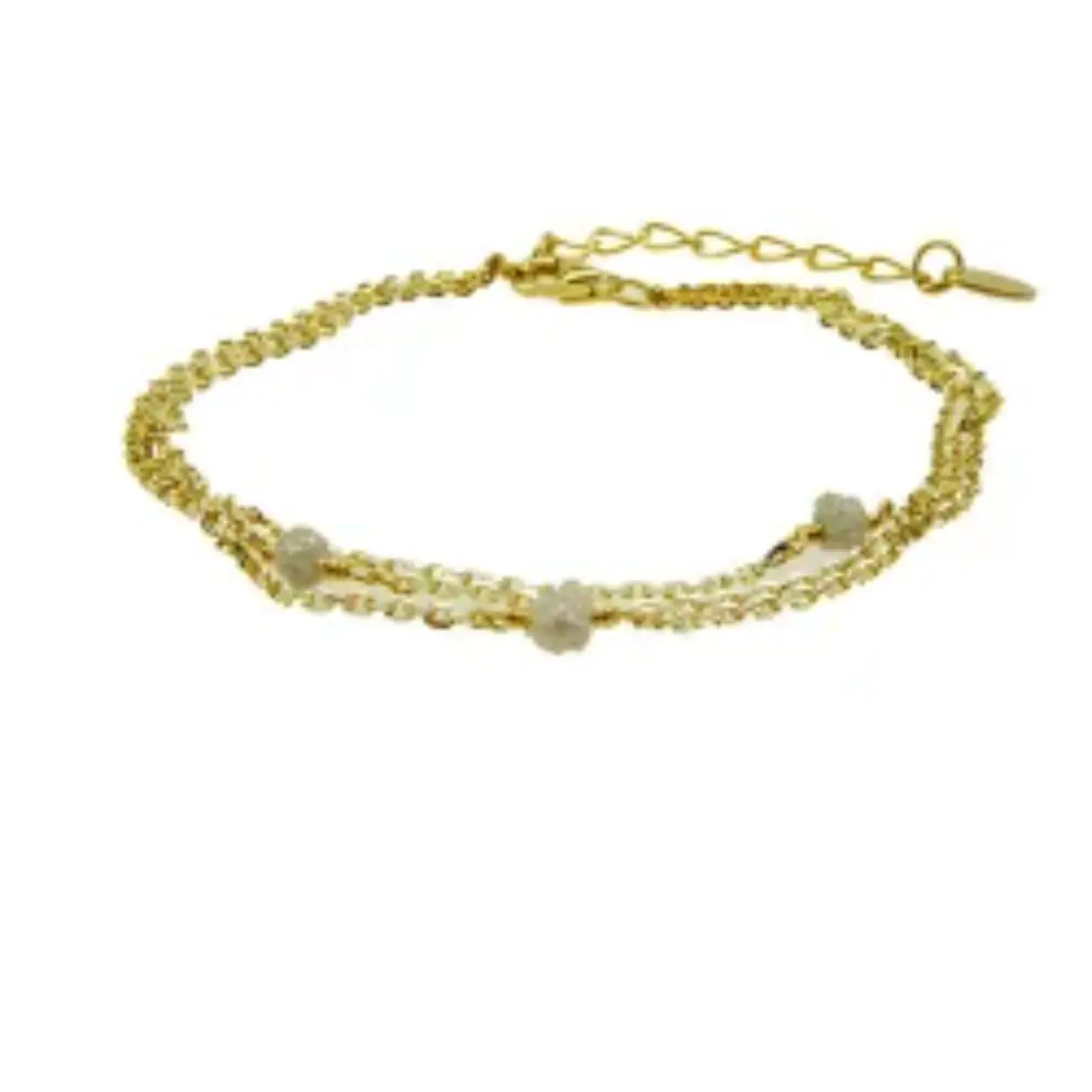 3 rij armbanden met elk hun eigen grijze Raw Diamond en gemaakt van verguld Sterling zilver en met 4cm verlengkettinkje.

De kettingen zijn aan alle kanten gediamanteerd/gefacetteerd, daarom veel glanzender/glinsterender dan gewone ankerketting - zeer opwindende look.
