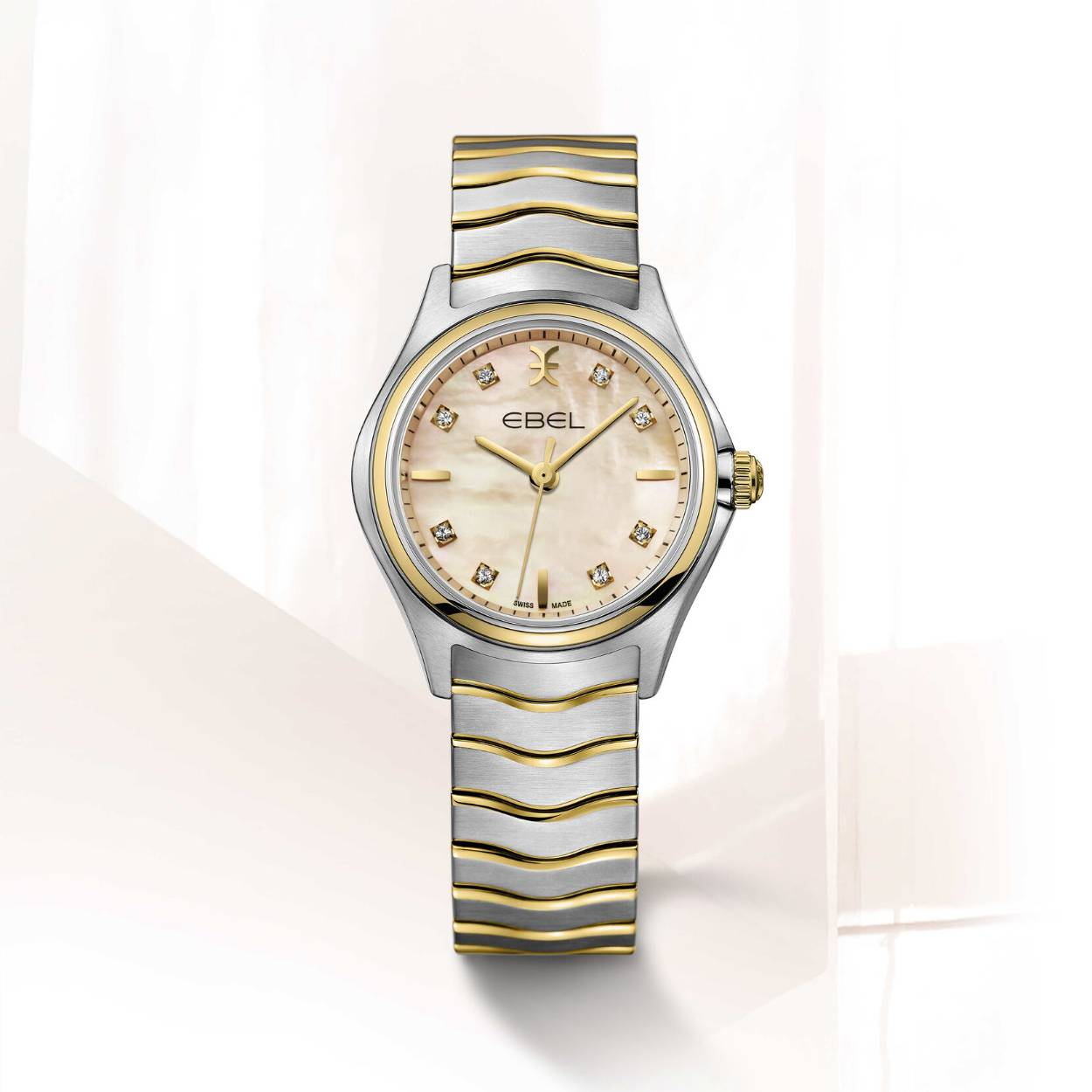 Women's EBEL Wave watch, stainless steel and 18K yellow gold case, Ø 30mm, apricot mother-ofpearl dial with 8 diamonds (0.052ct) and applied indexes, sapphire crystal with antireflective treatment underneath, two-tone stainless steel wave link bracelet, Swiss quartz movement, water-resistant up to 5 bar