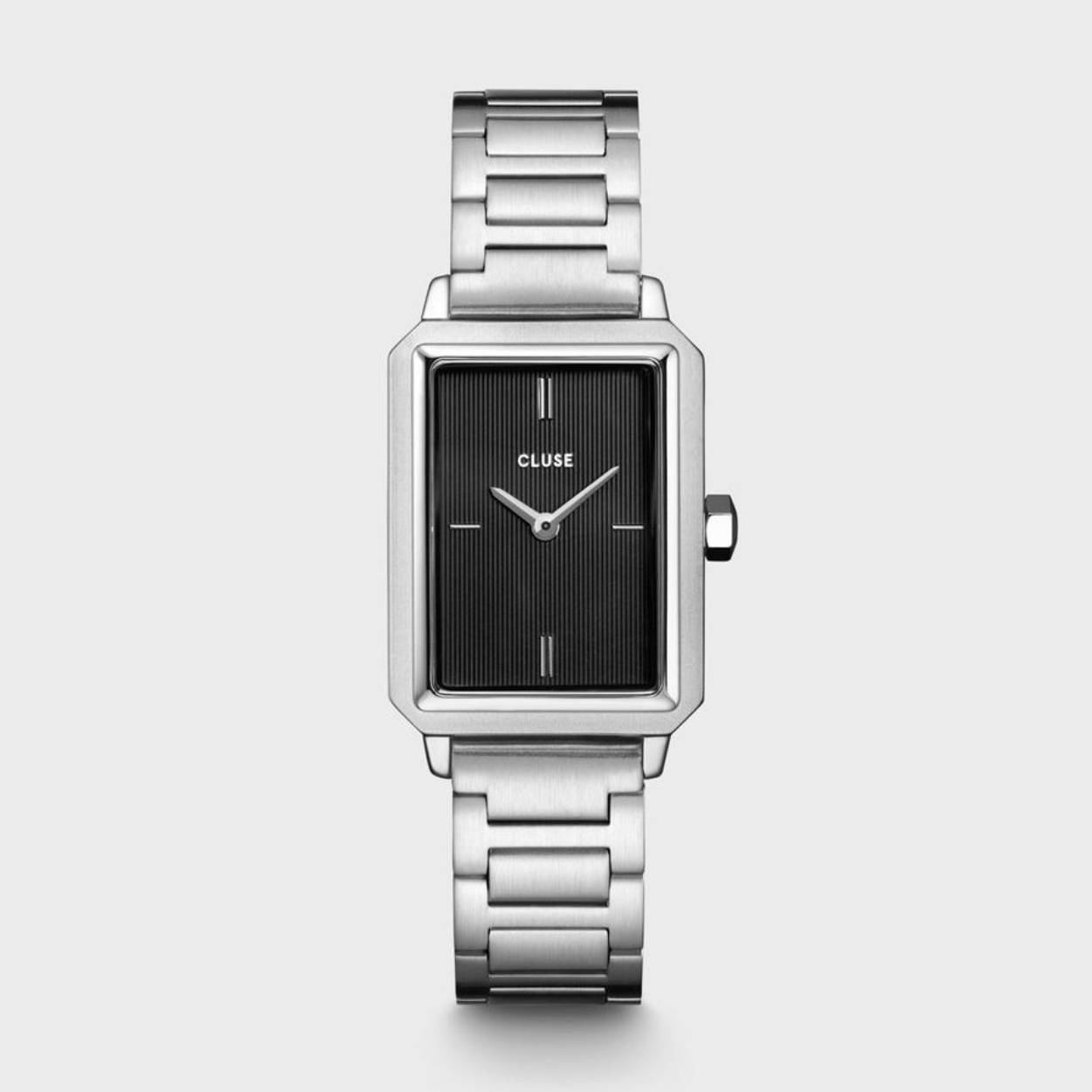 When elegant chic unites with timeless class. Braced with a polished 30.6 mm case and a classic stainless-steel link bracelet, our Fluette watch in black and silver colour seamlessly blends sophistication with an air of vintage. Featuring a matte black textured dial and our signature rectangular case shape, we’ve carefully designed this eye-catcher with a unique intention in mind - to instantly create a strong presence. You can easily adjust the strap size by yourself. Crown your wrist with this timeless piece, and carry a minimalistic, unique flair with every step you take.