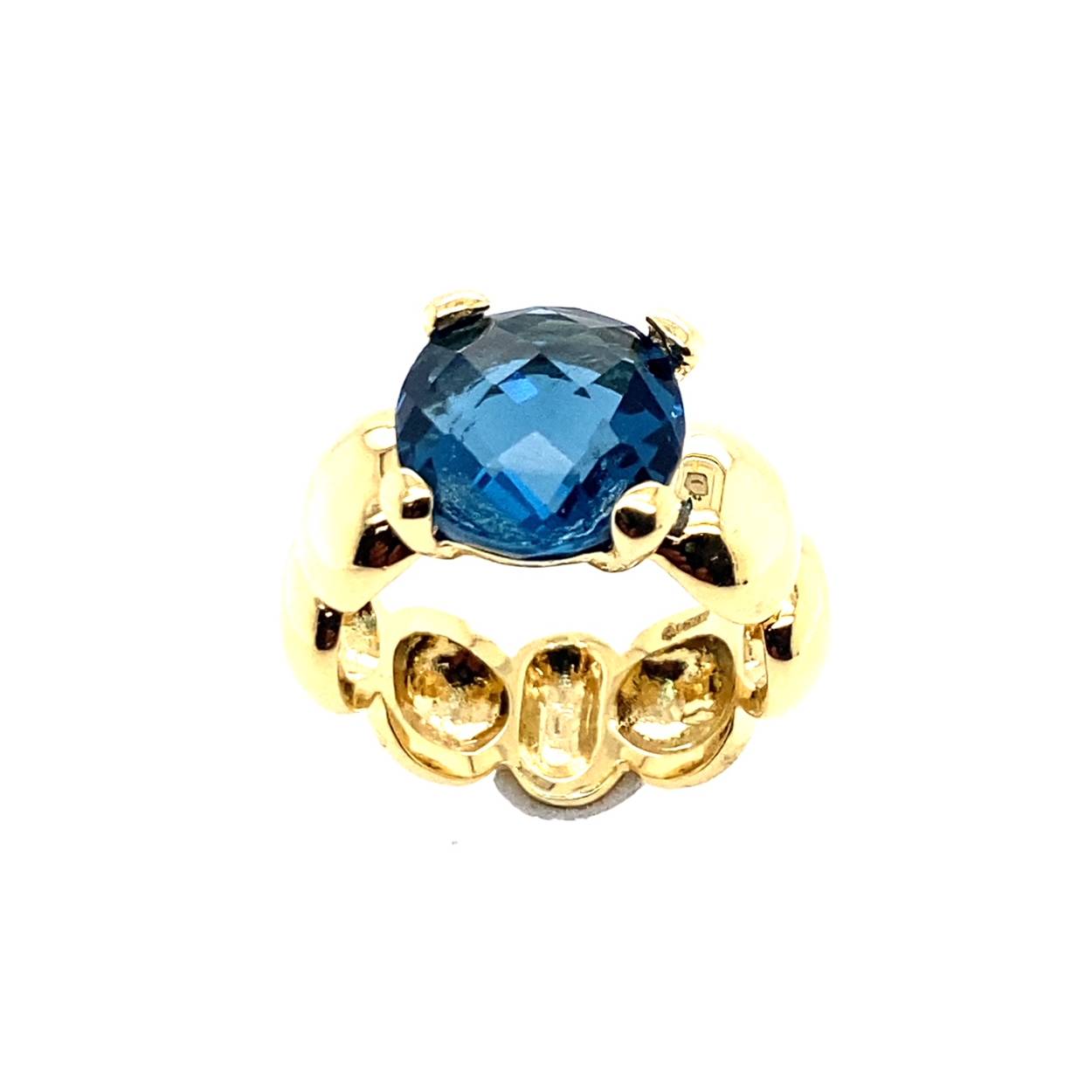 geelgouden damesring met london blue topaas