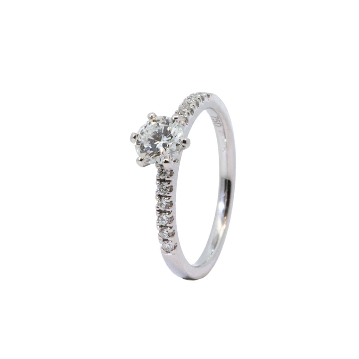 Witgouden solitair met rijstenen van 0.60ct