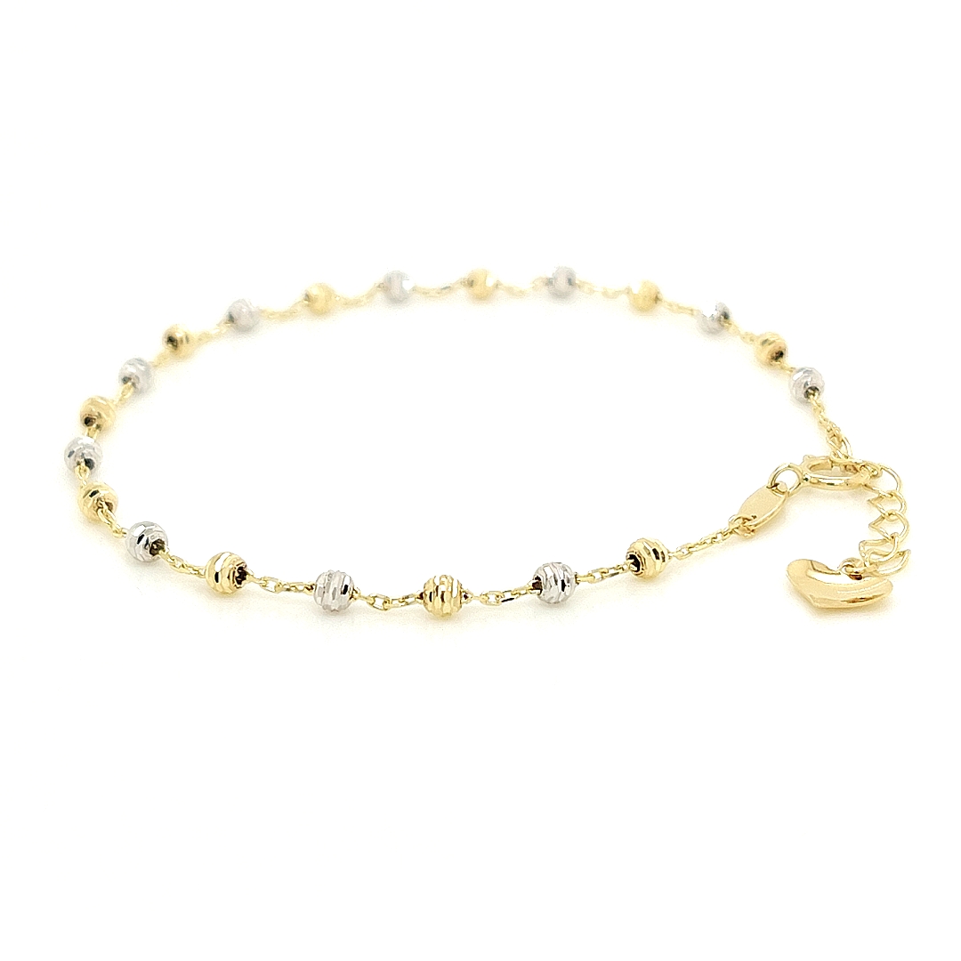 Deze 14-karaats bicolor gouden armband is onwijs leuk! De armband is anker geschakeld met witgouden en geel gouden fantasie bolletjes. Dit armbandje is verstelbaar van 17cm tot 19cm. 

Armband GAS138WRSM is een set met collier GCS081WRSM.
