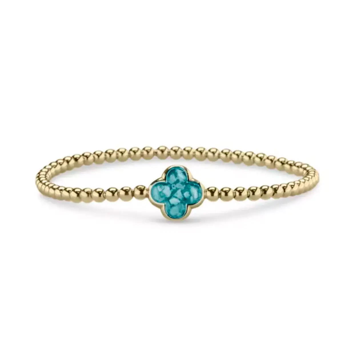 Gouden bolletjes armband. Deze armband is voorzien van een staaldraad (geen elastiek). De armband moet net over de hand kunnen schuiven om mooi aangesloten aan de pols te kunnen dragen. Dit sieraad wordt zichtbaar aan de voorkant gevuld met as of haar en wordt vermengd met onze speciale hars.