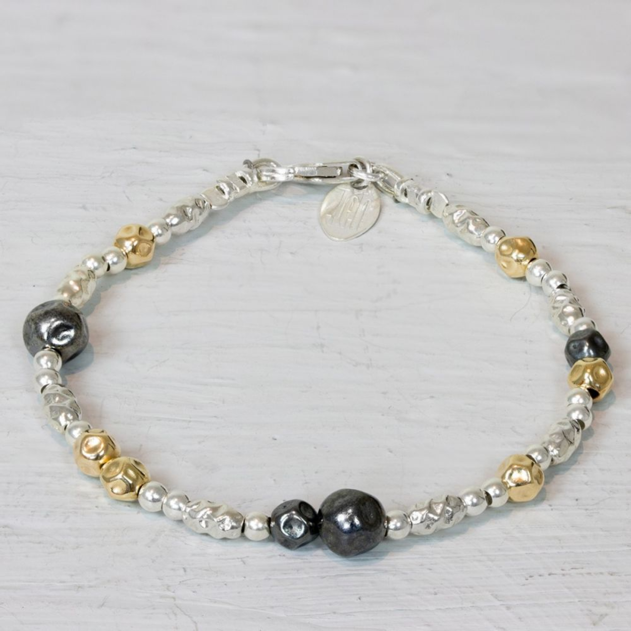 Armband  van Jéh Jewels met buisjes, gemaakt van 925 sterling zilver, geoxideerd zilver en goldfilled.