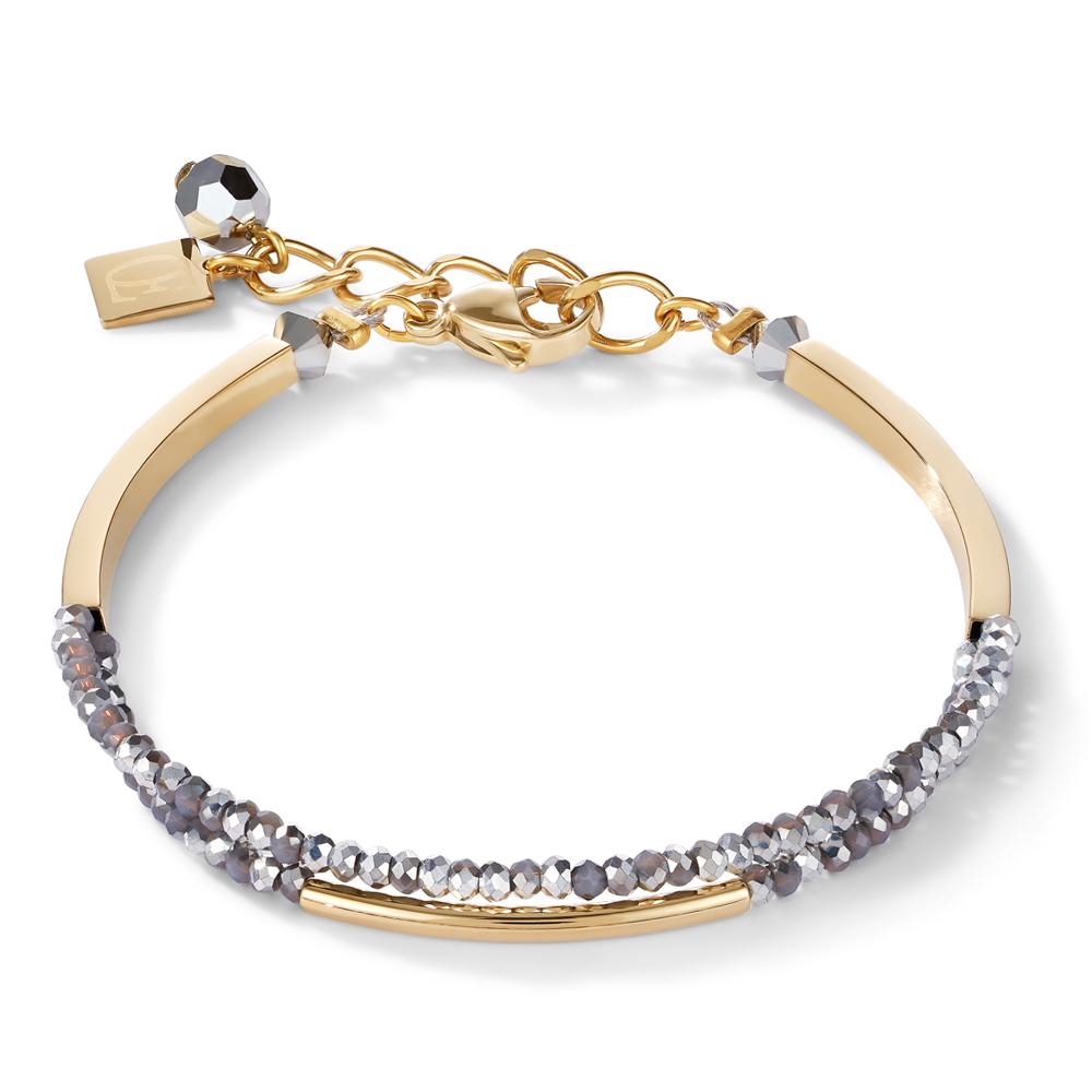 Coeur de Lion armband, Waterfall, vergulde stalen armband met grijze van geslepen glas. Armband is uit te breiden tot een set met bijpassende oorhangers en collier.

Elegante waterval armband
Goudkleurig edelstaal en geslepen glas
Handgemaakt in Duitsland
Lengte ca. 18 cm + 3 cm verlengketting
Dikte circa 0,3 cm
Roestvrijstalen karabijnsluiting