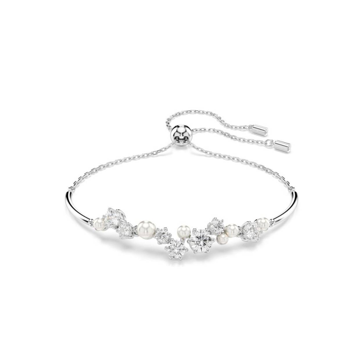 Omarm de oneindige magie van de sterren met deze schitterende Constella-armband. Het geïnspireerde ontwerp bestaat uit een delicate ketting en een cluster van Swarovski Zirkonia en Swarovski Crystal Pearls in verschillende formaten, die tussen de metalen staafjes van het sieraad lijken te zweven. Een sluiting met trekmechanisme zorgt bovendien voor een perfecte pasvorm voor elke pols. Combineer dit met andere Constella-sieraden voor een stralende ode aan de nachtelijke hemel.