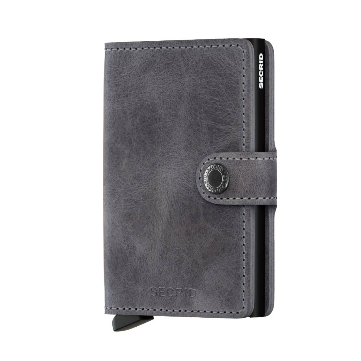 Onze meest iconische wallet en de perfecte allrounder: klein van formaat en verrassend groot in opbergcapaciteit. Met al zijn kleuren en stijlen past de Miniwallet in iedere broekzak.

Het gepatenteerde mechanisme geeft met één simpele beweging toegang tot je kaarten: klaar voor gebruik. De aluminium behuizing beschermt kaarten tegen buigen, breken en ongewenste draadloze communicatie.

Vintage
Ons vintage leer heeft een licht geschuurd oppervlak en een hoog wasgehalte dat het voorziet van een stonewashed look. Dit levendige leer wordt persoonlijker met gebruik.

Miniwallet Vintage Grey & Black is gecorrigeerd leer, gemaakt in Nederland van Europese runderhuiden. Bezoek onze leerpagina voor meer informatie over leereigenschappen, ons productieproces en verzorgingsinstructies.

Draagt
4 verdikte of 6 platte kaarten
4 extra kaarten
Bankbiljetten
Visitekaartjes
Bonnetjes
Afmetingen en gewicht
65 x 102 x 21 mm
72 g
2 jaar garantie 